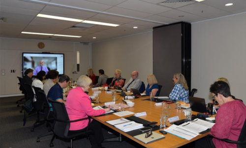 Modern image of board members at desk