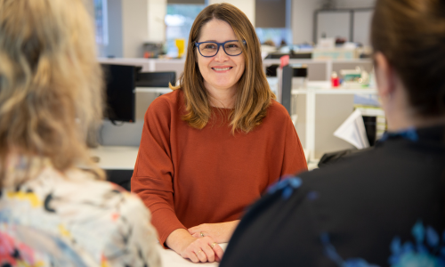 Smiling staff member in office